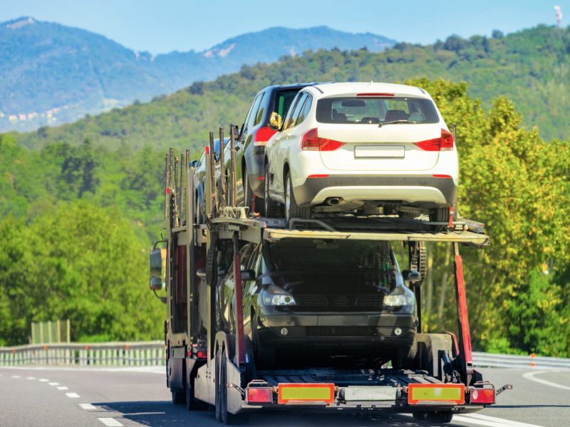 Car transporter truck on the road in Switzerland.